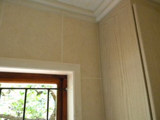 Detail Of Cornices, White Washed Ceilings And Trim Around Window