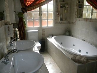 Bathroom With A Spa Bath And Double Sink