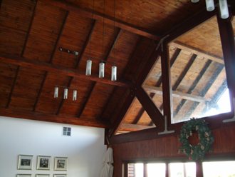 roof trusses visible on a high-pitch ceiling