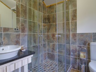 Shower-room with modern tiles, built-in mirror and vanity